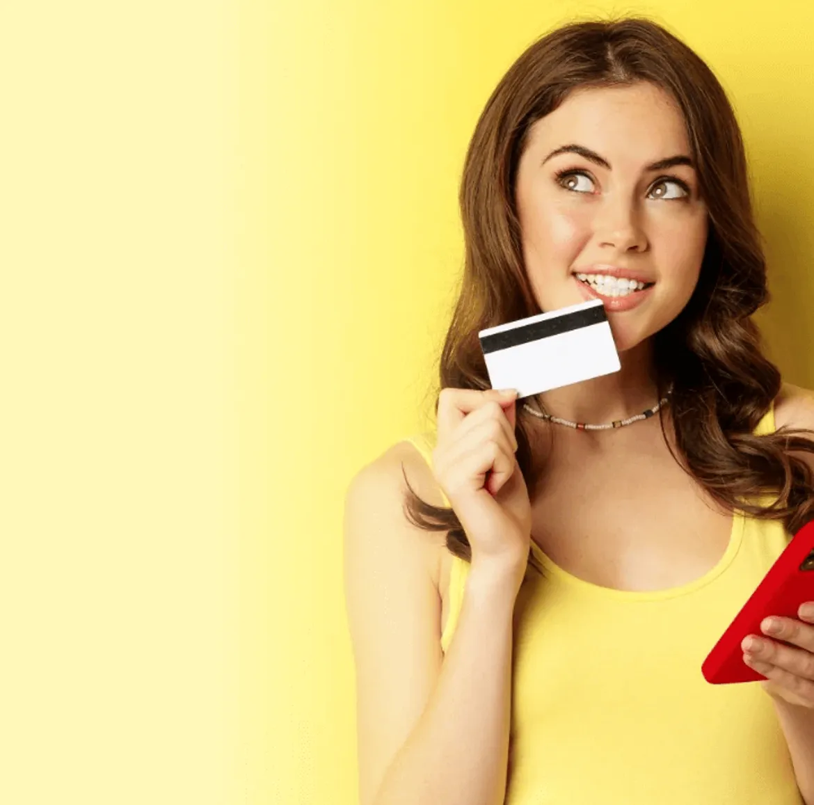 Gen Z girl holding credit card and phone