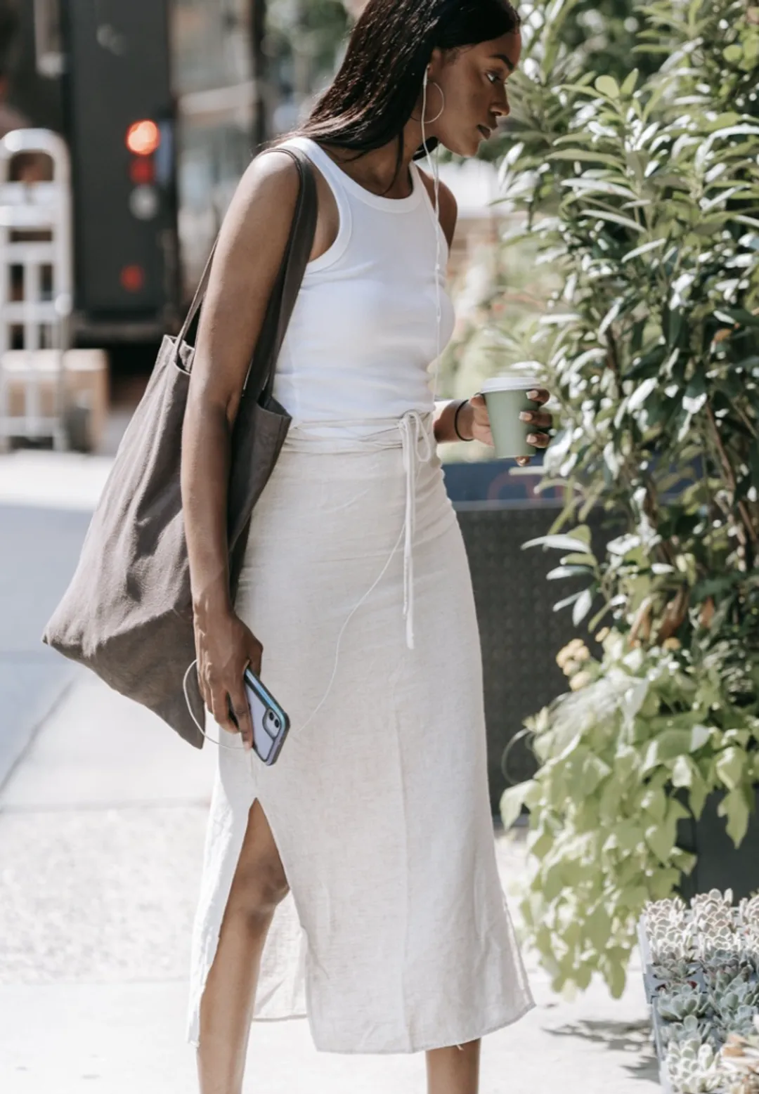 Hourglass body wearing a white A-line skirt, perfect for balanced proportions