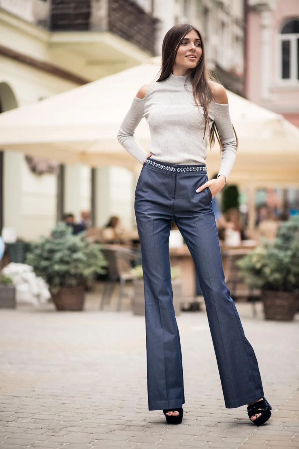 Woman with hourglass body shape in high-waisted bootcut jeans
