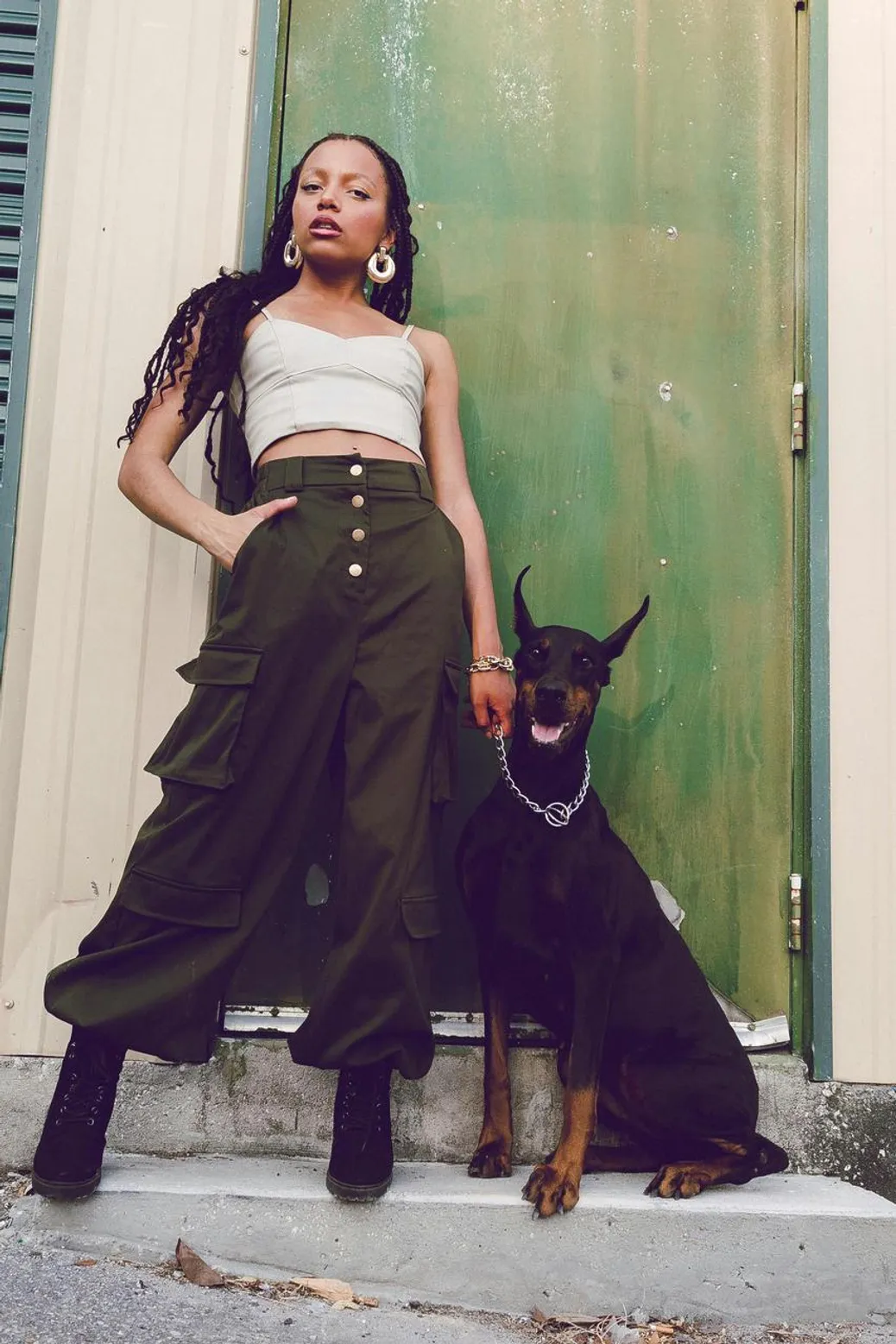 Olive cargo pants styled with a white tee and red leather jacket for a sporty movie look