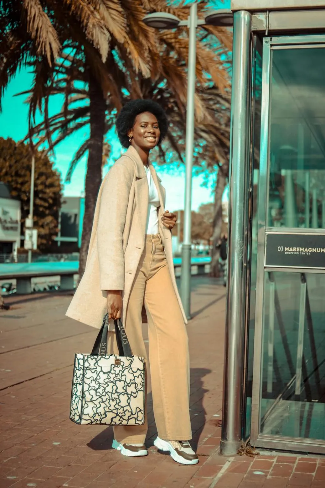 Woman wearing earthy-toned corduroy pants and coat for fall fashion