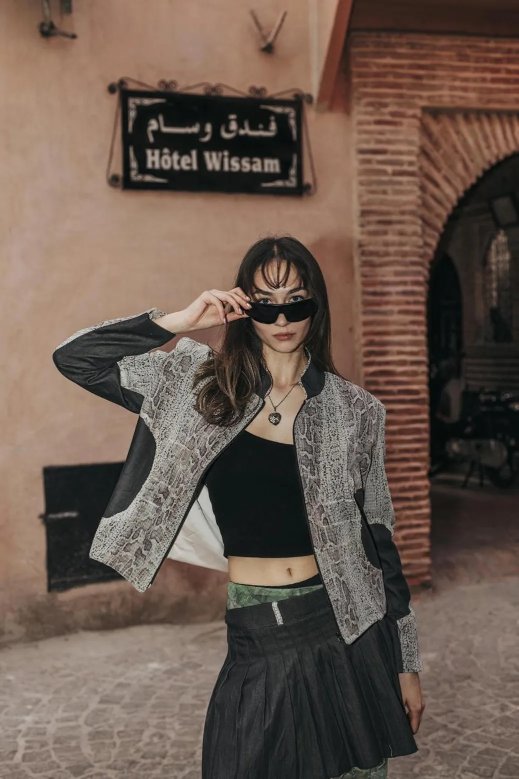 Woman wearing a crocodile-print jacket for a bold and stylish fall look