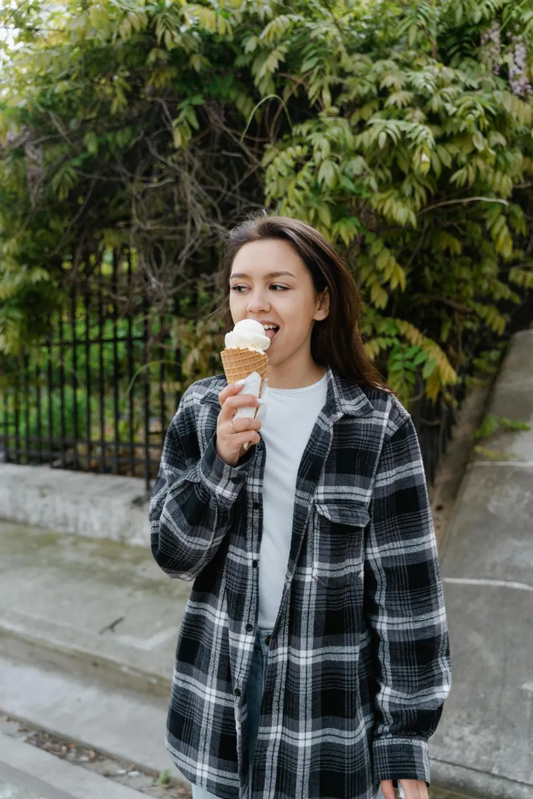 Flannel shirt paired with corduroy pants and ankle boots for a cozy fall movie night outfit