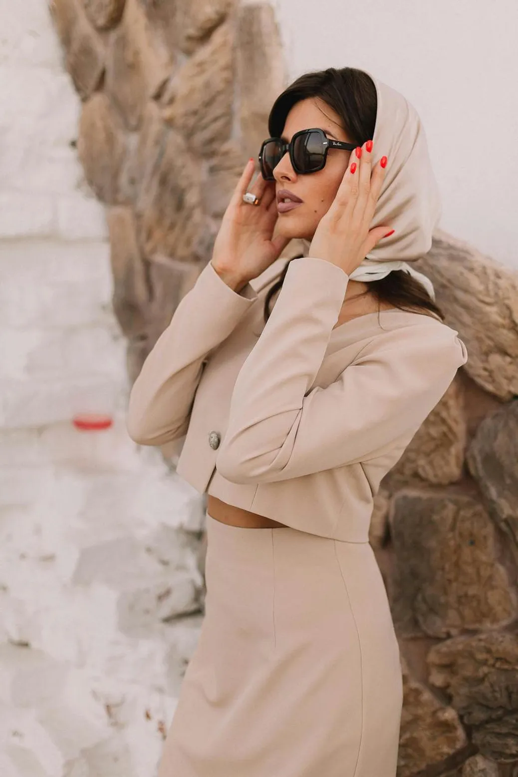 Beige matching set styled with bold shoes and statement jewelry for an effortless look