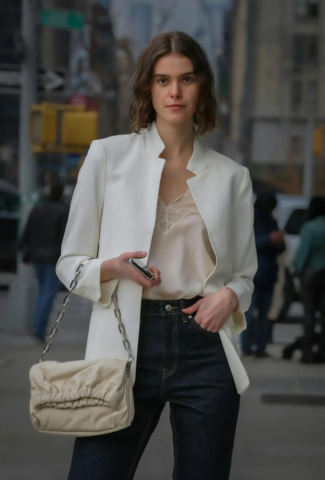 Sharp-shouldered jacket styled with parachute pants for a bold and confident look