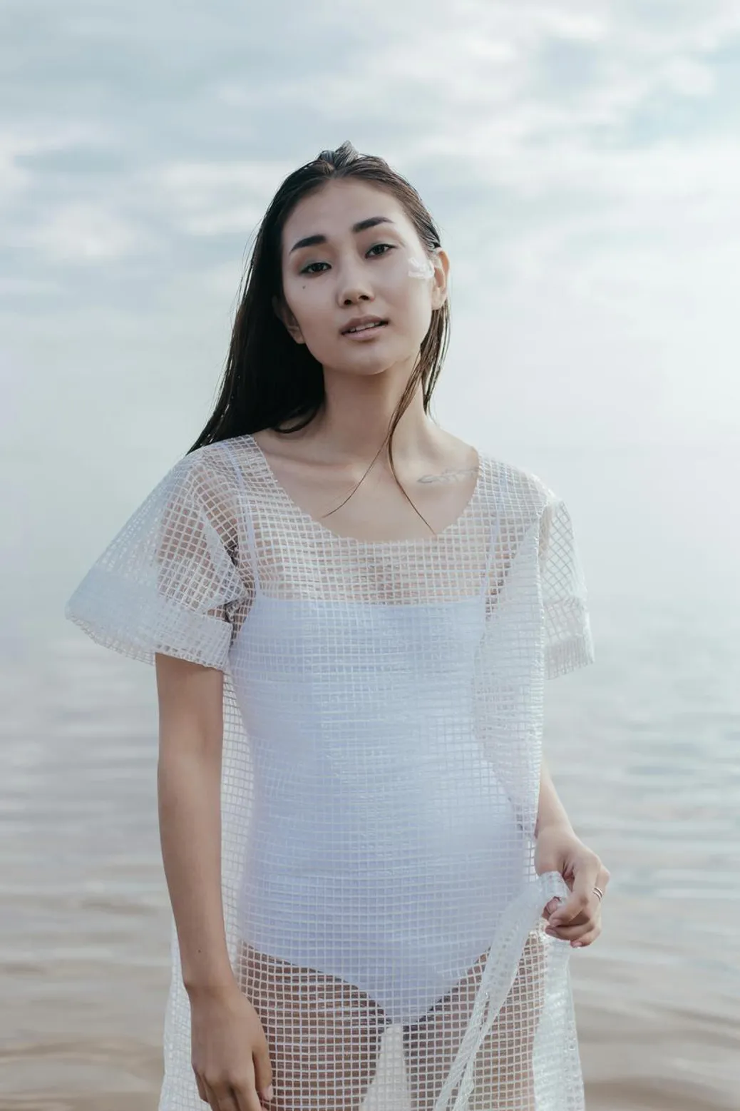 modern white mesh dress at the beach