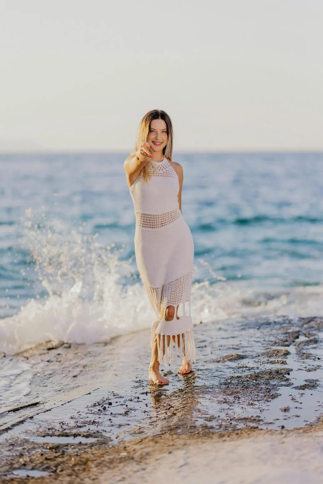 Boho maxi dress styled with gladiator sandals and layered jewelry