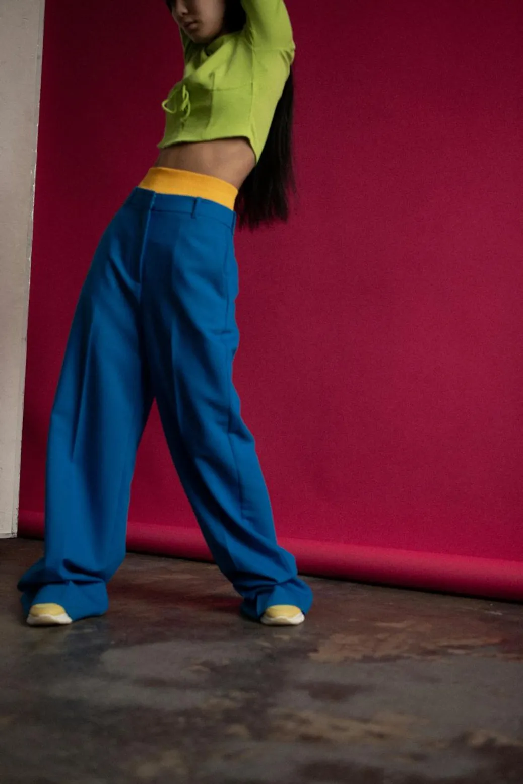A bold and colorful fashion shot featuring a model in vibrant contrasting tones.