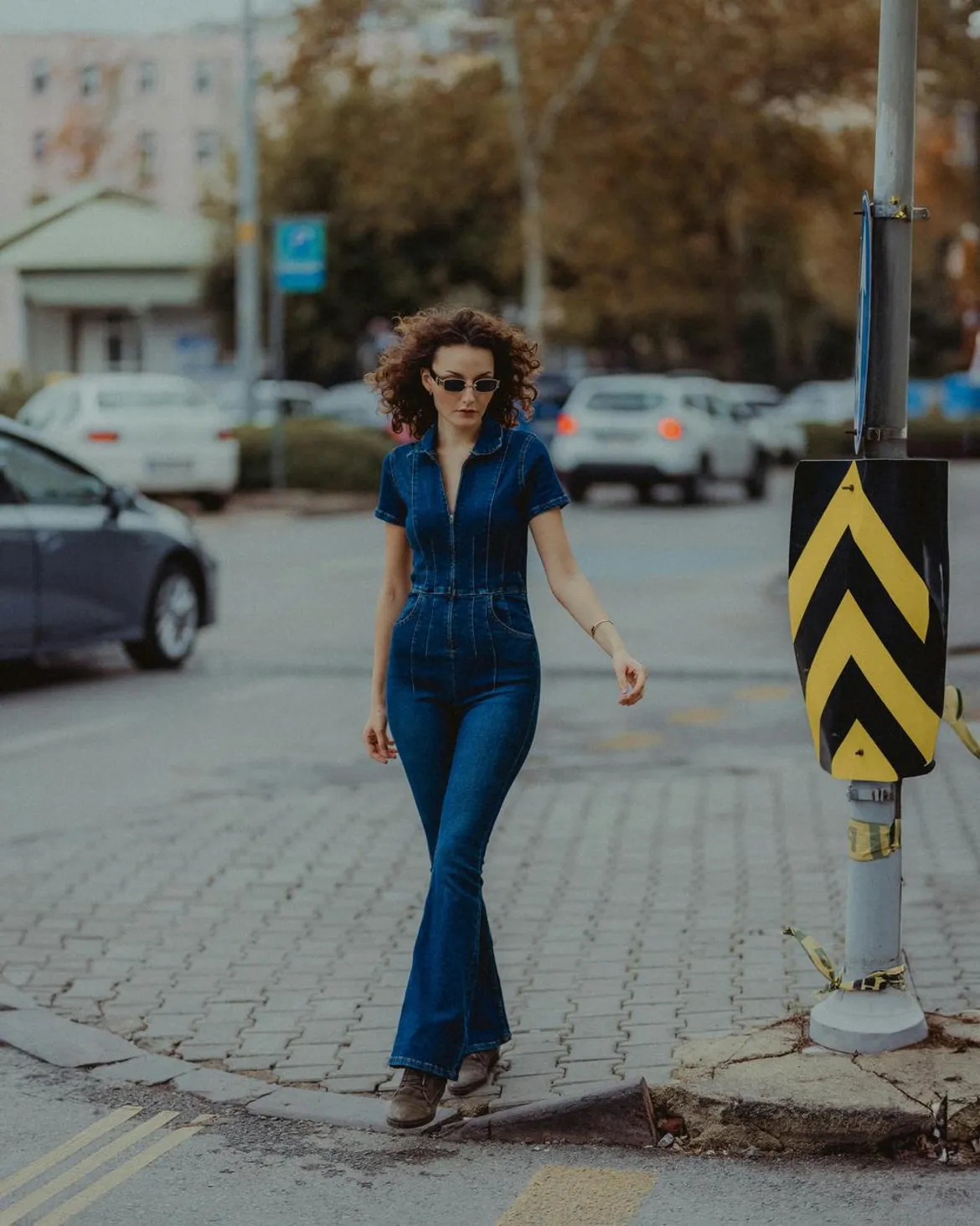 Light-wash denim jumpsuit with platform wedges
