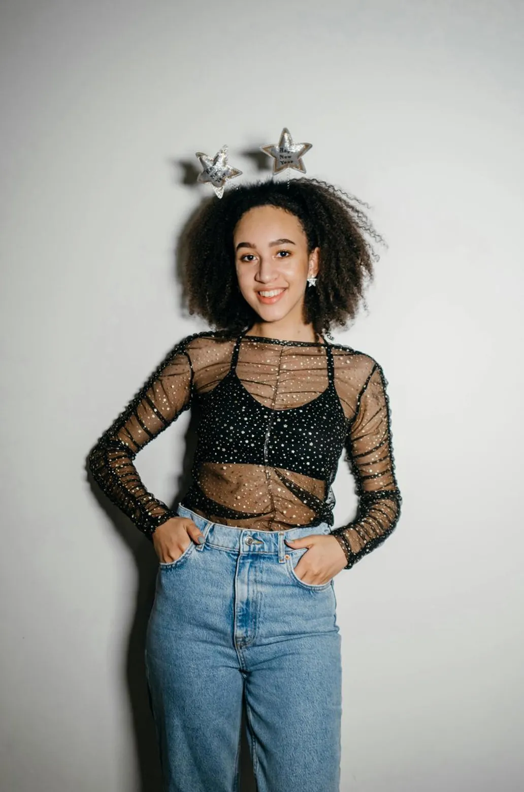 Bold patterned mesh top with baggy jeans for spring break