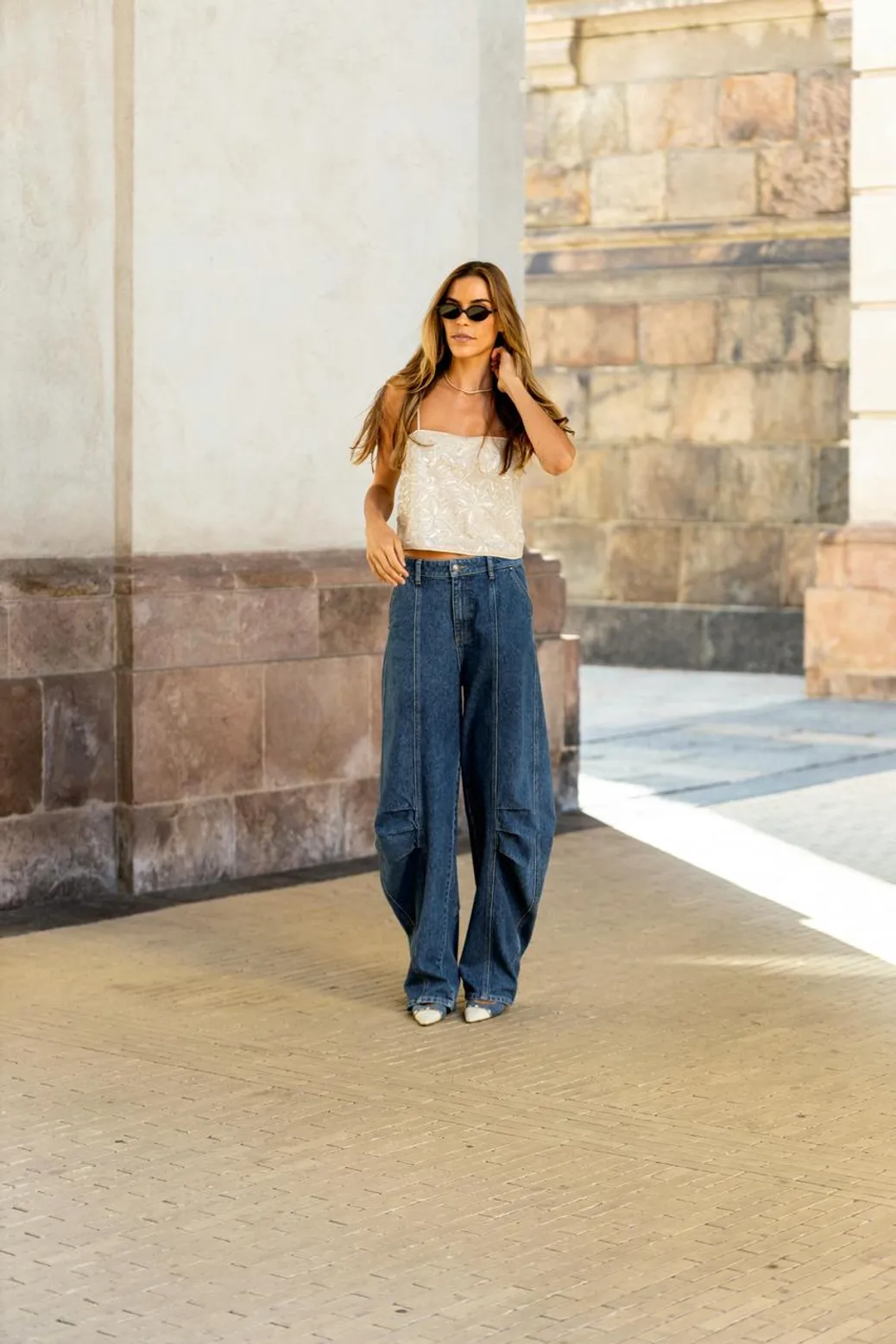 Sleeveless vest and wide-leg pants with a saddle bag